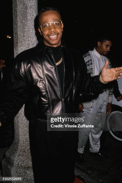 American rapper and dancer MC Hammer, wearing a black leather jacket over a black sweater, with a gold necklace, United States, circa 1991.
