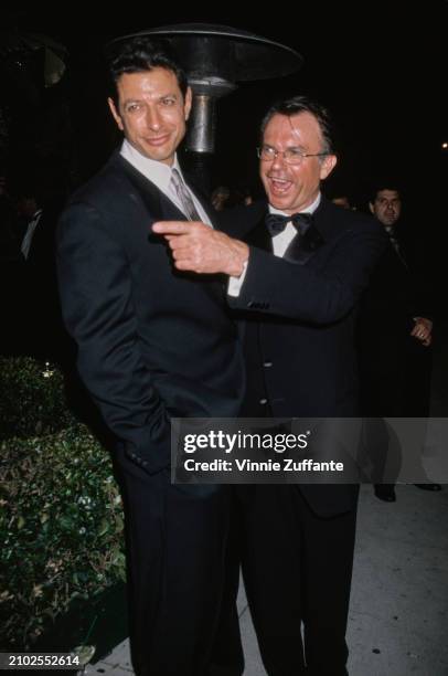 American actor Jeff Goldblum, wearing a black suit with a white shirt and a grey tie, and Northern Ireland-born New Zealand actor Sam Neill, who...