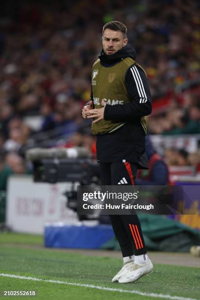 Aaron Ramsay of Wales warms up during the UEFA EURO 2024 Play-Offs Semi-final between Wales and Finland at Cardiff City Stadium on March 21, 2024 in...