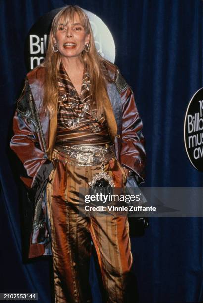 Canadian-American singer-songwriter and musician Joni Mitchell attends the inaugural Billboard Music Awards, held at the Barker Hangar at Santa...