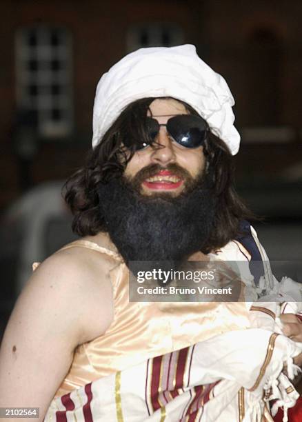 Aaron Barschak, dressed as Osama Bin Laden poses for photographers outside Prince William's 21st birthday party June 21, 2003 at Windsor Castle,...