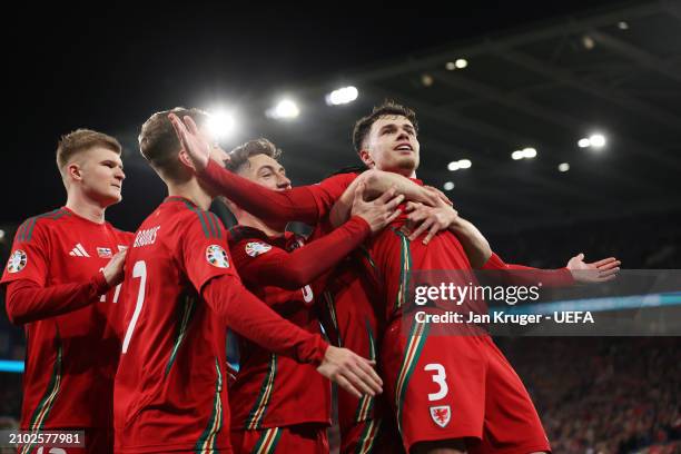 Neco Williams of Wales celebrates scoring his team's second goal with Harry Wilson and team mates during the UEFA EURO 2024 Play-Offs Semi-final...