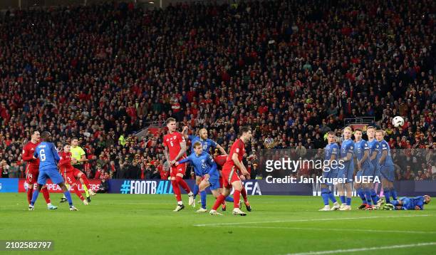 Neco Williams of Wales scores his team's second goal during the UEFA EURO 2024 Play-Offs Semi-final match between Wales and Finland at Cardiff City...