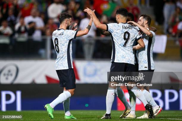 Bruno Fernandes of Portugal celebrates with team mates after scoring his team's third goal during the international friendly match between Portugal...