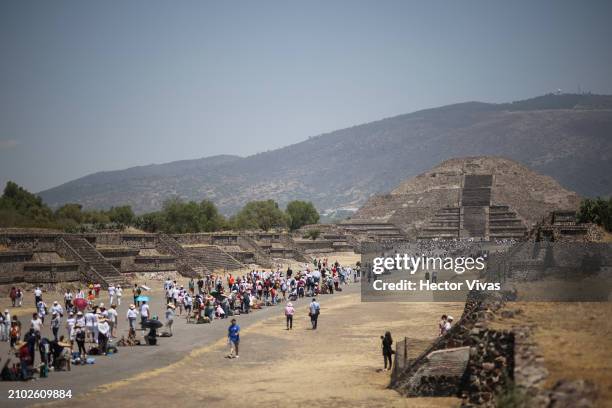 View of the 'Calzada de los Muertos' and in the background the Pyramid of the Moon as people arrive during the celebrations for the Spring Equinox on...