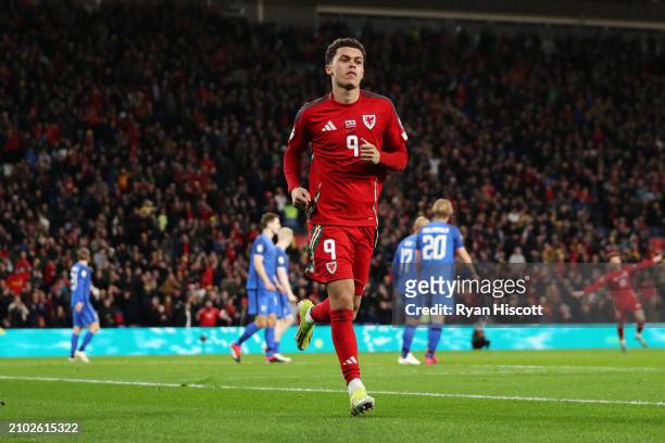 Brennan Johnson of Wales celebrates scoring his team's third goal during the UEFA EURO 2024 Play-Offs Semi-final match between Wales and Finland at...