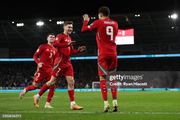 Brennan Johnson of Wales celebrates scoring his team's third goal with Neco Williams and David Brooks during the UEFA EURO 2024 Play-Offs Semi-final...