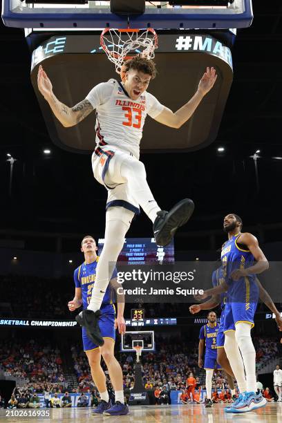 Coleman Hawkins of the Illinois Fighting Illini dunks the ball against the Morehead State Eagles during the first half in the first round of the NCAA...