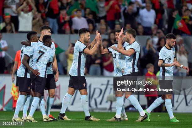 Goncalo Ramos of Portugal celebrates with his team mates after scoring his team's fifth goal during the international friendly match between Portugal...