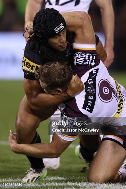 Billy Walters of the Broncos is tackled by Jarome Luai of the Panthers during the round three NRL match between Penrith Panthers and Brisbane Broncos...