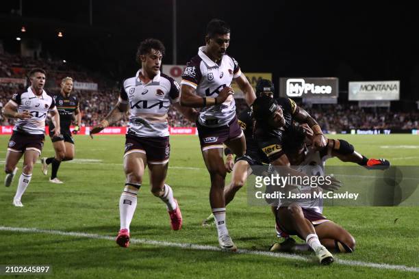 Selwyn Cobbo of the Broncos is tackled by Brian To'o of the Panthers during the round three NRL match between Penrith Panthers and Brisbane Broncos...