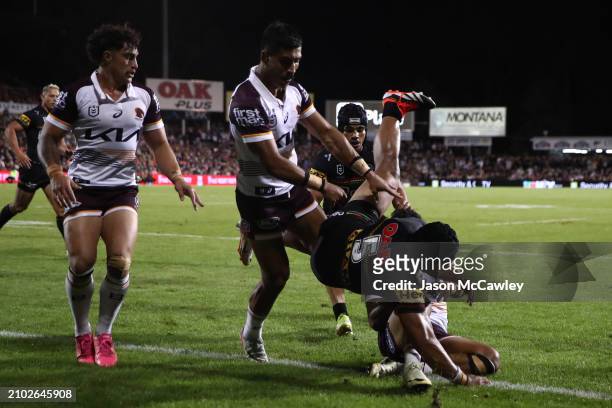 Selwyn Cobbo of the Broncos is tackled by Brian To'o of the Panthers during the round three NRL match between Penrith Panthers and Brisbane Broncos...