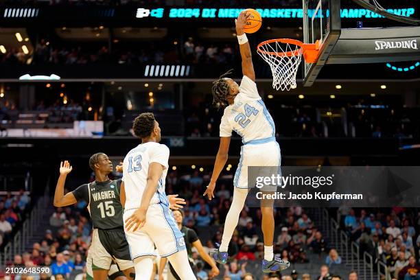 Jae'Lyn Withers of the North Carolina Tar Heels dunks the ball against the Wagner Seahawks during the second half in the first round of the NCAA...