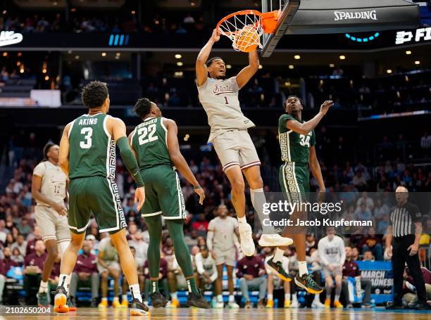 Tolu Smith of the Mississippi State Bulldogs dunks the ball against the Michigan State Spartans in the first round of the NCAA Men's Basketball...