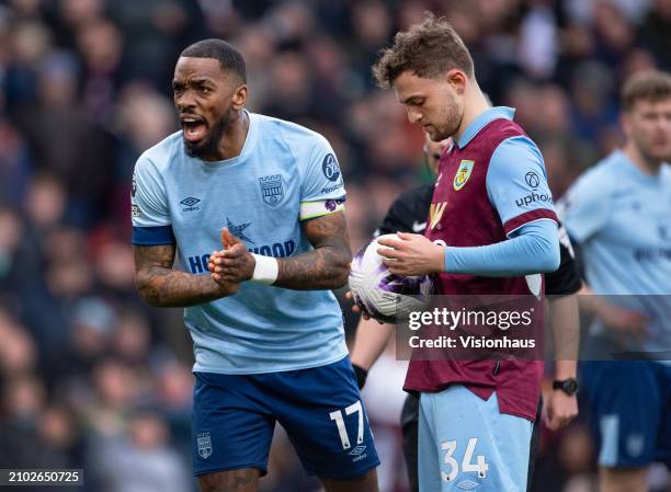 Ivan Toney of Brentford encourages his goalkeeper whilst Jacob Bruun Larsen of Burnley waits to take a penalty during the Premier League match...