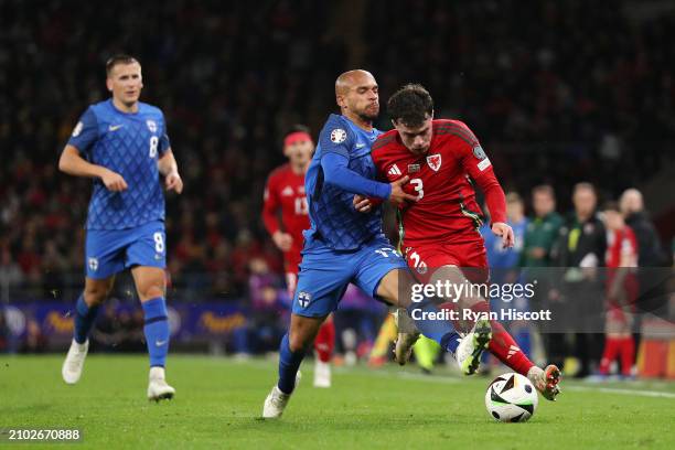 Neco Williams of Wales is challenged by Nikolai Alho of Finland during the UEFA EURO 2024 Play-Offs Semi-final match between Wales and Finland at...