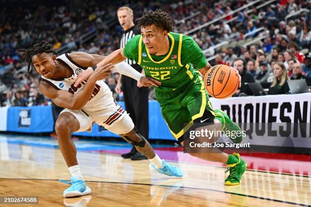 Jadrian Tracey of the Oregon Ducks drives to the basket against Meechie Johnson of the South Carolina Gamecocks in the second halaf in the first...