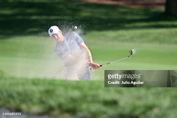 Daniel Berger of the United States plays a shot from a bunker on the seventh hole during the first round of the Valspar Championship at Copperhead...