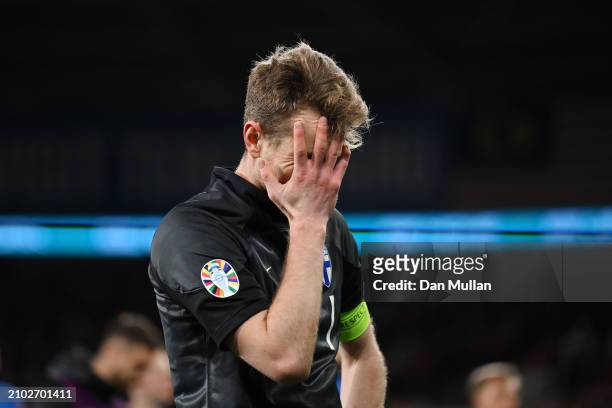 Lukas Hradecky of Finland looks dejected after the team's defeat in the UEFA EURO 2024 Play-Offs Semi-final match between Wales and Finland at...