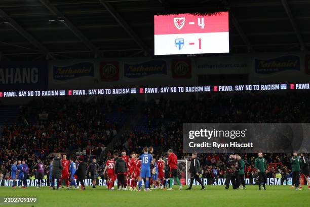 General view inside the stadium as the LED displays the final score as Wales 4-1 Finland as players shake hands after the UEFA EURO 2024 Play-Offs...