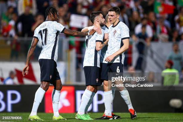 Bruno Fernandes of Portugal celebrates with team mates after scoring his team's third goal during the international friendly match between Portugal...