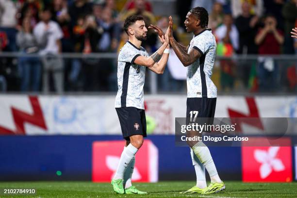 Bruno Fernandes of Portugal celebrates with Rafael Leao of Portugal after scoring his team's third goal during the international friendly match...