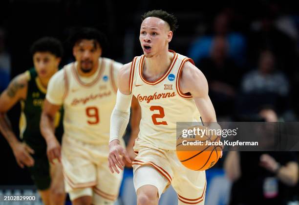 Chendall Weaver of the Texas Longhorns dribbles the ball during the first half against the Colorado State Rams in the first round of the NCAA Men's...