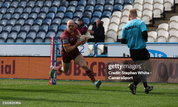 Huddersfield Giants' Adam Swift scores a second half try during the Betfred Challenge Cup Round 6 match between Huddersfield Giants and Hull FC at...