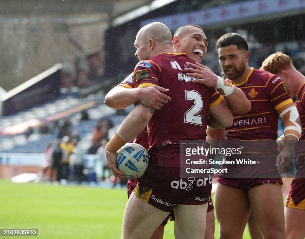 Huddersfield Giants' Adam Swift celebrates scoring his third try during the Betfred Challenge Cup Round 6 match between Huddersfield Giants and Hull...