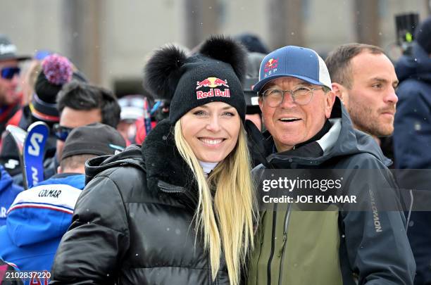 Former alpine ski racer Lindsey Vonn and Red Bull's Robert Trenkwalder pose on the sidelines of the men's Downhill event, that eventually was...