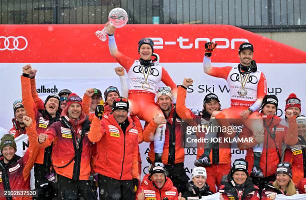 The overall season winner of the Men's FIS Alpine Skiing World Cup Switzerland's Marco Odermatt and the second placed in the overall season of the...