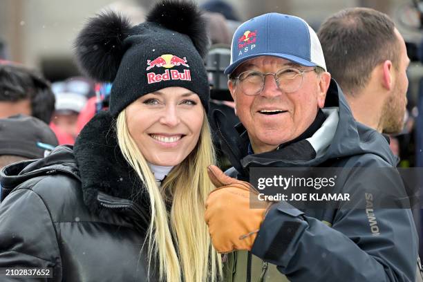 Former alpine ski racer Lindsey Vonn and Red Bull's Robert Trenkwalder pose on the sidelines of the men's Downhill event, that eventually was...