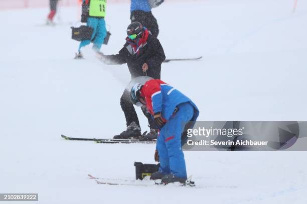 Workers trying to fix the course during the Audi FIS Alpine Ski World Cup Finals - Mens Downhill on March 24, 2024 in Saalbach-Hinterglemm, Austria.