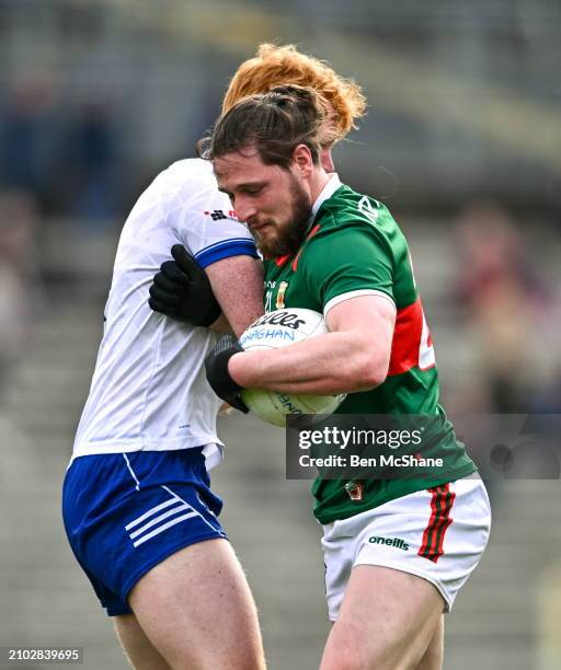 Monaghan , Ireland - 24 March 2024; Padraig O'Hora of Mayo and Ryan O'Toole of Monaghan tussle during the Allianz Football League Division 1 match...