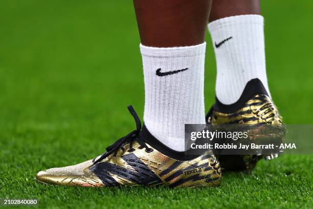 The gold custom New Balance football boots of Endrick of Brazil during the international friendly match between England and Brazil at Wembley Stadium...