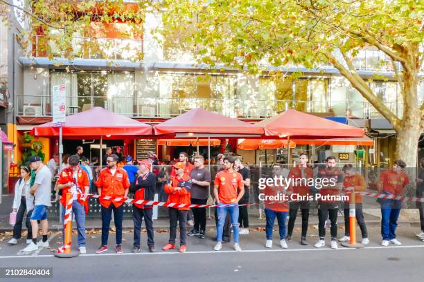 Fans celebrate Scuderia Ferrari driver Carlos Sainz winning the Australian Grand Prix with Charles LeClerc of Ferrari in second place in Melbourne,...