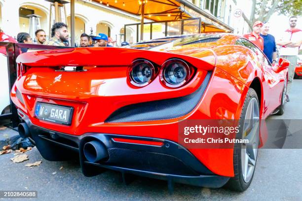 Fans celebrate Scuderia Ferrari driver Carlos Sainz winning the Australian Grand Prix with Charles LeClerc of Ferrari in second place in Melbourne,...