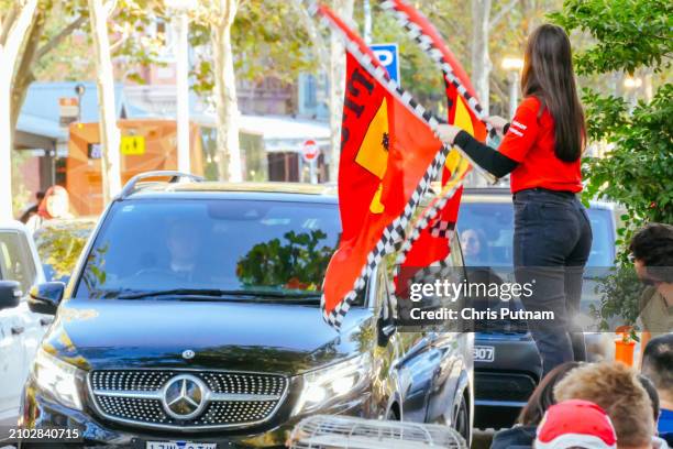 Fans celebrate Scuderia Ferrari driver Carlos Sainz winning the Australian Grand Prix with Charles LeClerc of Ferrari in second place in Melbourne,...