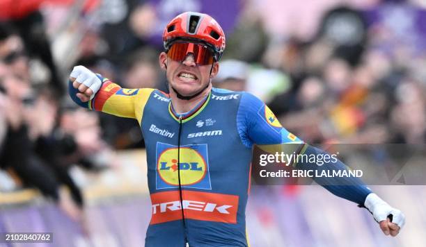 Team Lidl-Trek's Dane rider Mads Pedersen celebrates as he crosses the finish line to win the Cycling World Tour Gent-Wevelgem men's 253,1 km race...