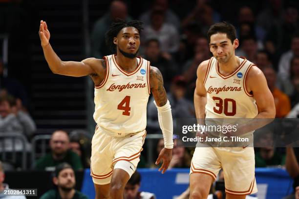 Tyrese Hunter of the Texas Longhorns reacts after a dunk during the first half against the Colorado State Rams in the first round of the NCAA Men's...