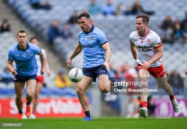 Dublin , Ireland - 24 March 2024; Colm Basquel of Dublin scores a goal, in the 13th minute, despite the attention of Kieran McGeary of Tyrone during...