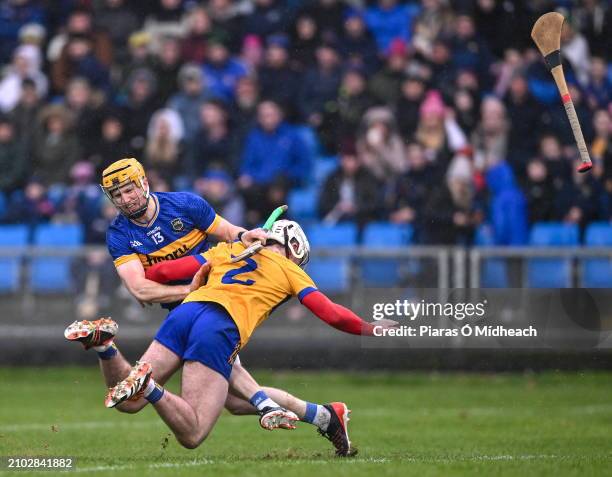 Laois , Ireland - 24 March 2024; Jake Morris of Tipperary and Adam Hogan of Clare tussle during the Allianz Hurling League Division 1 semi-final...