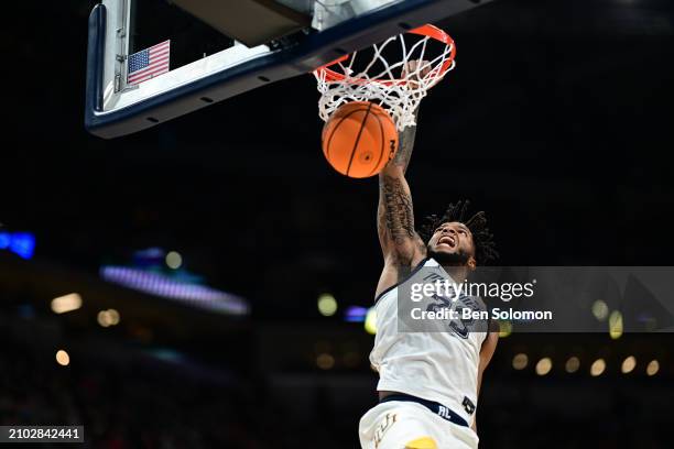 David Joplin of the Marquette Golden Eagles dunks the ball against the Colorado Buffaloes during the second round of the 2024 NCAA Men's Basketball...