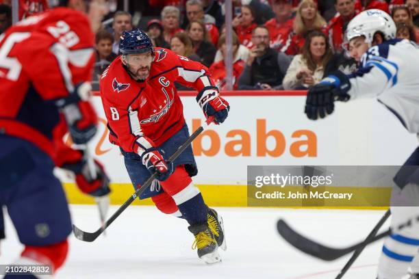 Alex Ovechkin of the Washington Capitals takes a shot on goal during a game against the Winnipeg Jets at Capital One Arena on March 24, 2024 in...