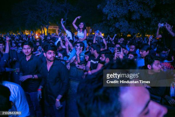 Students enjoy the performance of Bollywood singer, rapper, lyricist, and music composer Raftaar during the three-day cultural and tech fest, "Moksha...