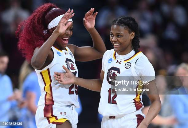 MiLaysia Fulwiley of the South Carolina Gamecocks laughs with teammate Raven Johnson during the second round of the 2024 NCAA Women's Basketball...