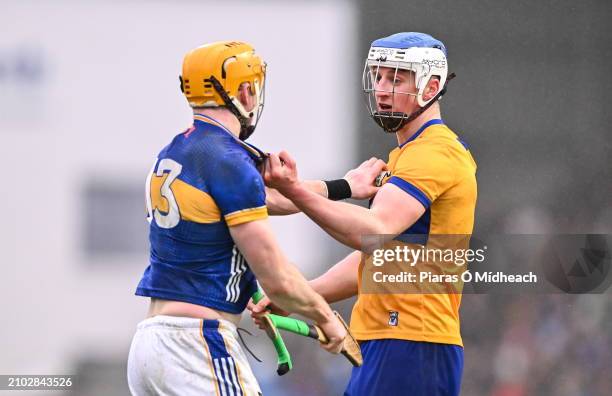 Laois , Ireland - 24 March 2024; Diarmuid Ryan of Clare and Patrick Maher of Tipperary tussle during the Allianz Hurling League Division 1 semi-final...