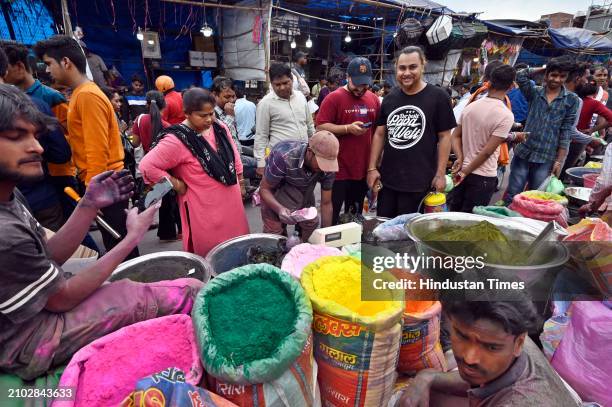 People buying and selling Holi colors and water guns before Holi Festival, at the busy market of Sadar bazaar, on March 24, 2024 in New Delhi, India.