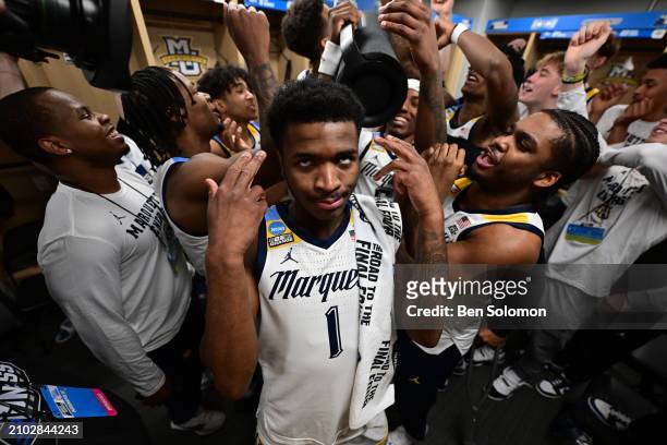 Kam Jones of the Marquette Golden Eagles celebrates in the locker room after a win against the Colorado Buffaloes during the second round of the 2024...