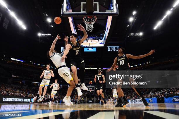 David Joplin of the Marquette Golden Eagles shoots the ball against KJ Simpson of the Colorado Buffaloes during the second round of the 2024 NCAA...